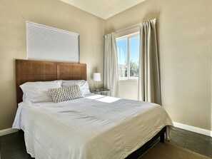 One of the bedrooms with a queen size bed.