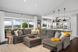 The entire space is bathed natural light from the oversized windows that look across the the property towards the hills and the Van Duzer Corridor.