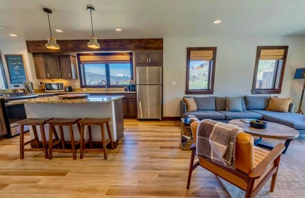 Open concept living surrounded by beautiful views out each window.