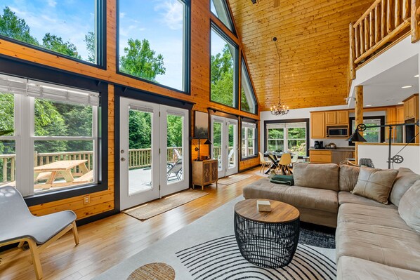 An open-concept living room is great for  movies,  games, or enjoying the views.