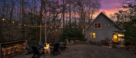 Relax by the cozy fire-pit located just steps outside the cabin.