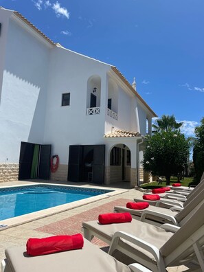 Pool area from side of the house to the gardens 