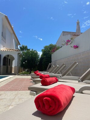 Sun loungers with cushions, and pool/beach towels provided