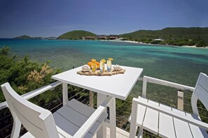 Afternoon drinks or morning coffee overlooking the crystal clear Caribbean water.