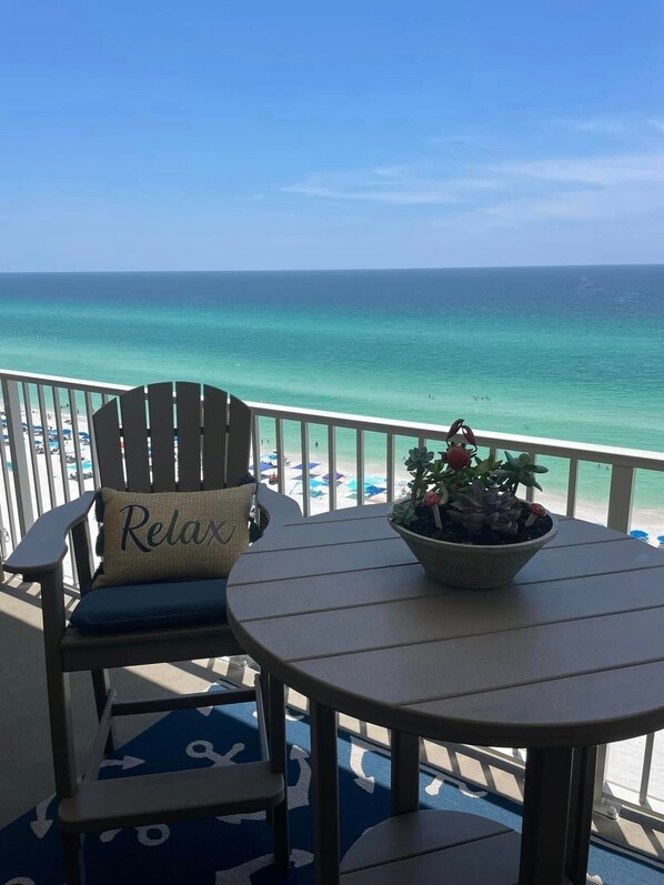 Balcony with TALL Chairs & Table. You can really watch the water & sunsets!