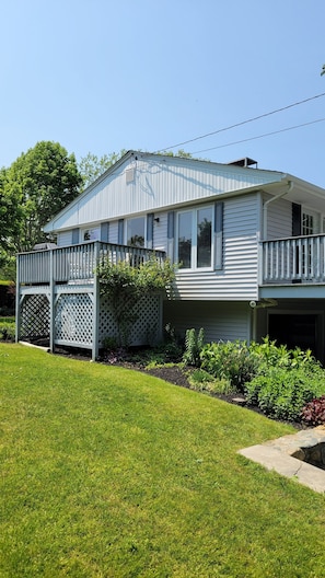 Side porch with grill and seating area