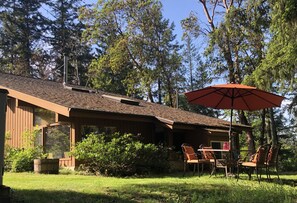 Outdoor dining between the suite and surrounding forest. 