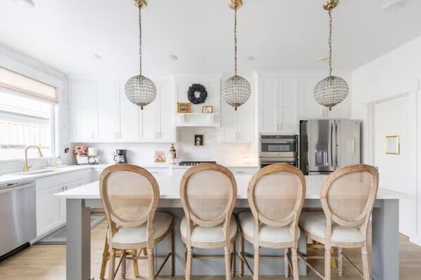 Chef's paradise: Gourmet kitchen on main level, gas range and 9' Island.