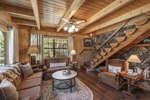 Living room with 1/2 log staircase to 3rd floor