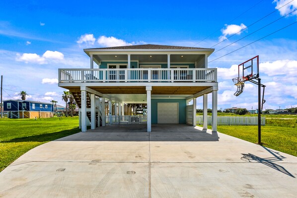 Enjoy sunny days on the spacious deck and outdoor basketball court!