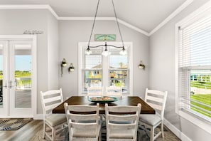 Create memories in a dining space filled with natural light from big windows!