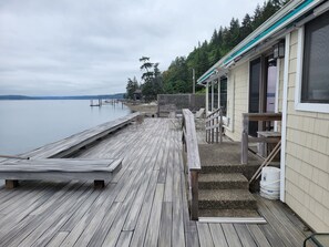 Stair and ramp access to kitchen sliding door.