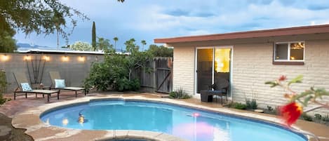 Heated pool and spa in backyard