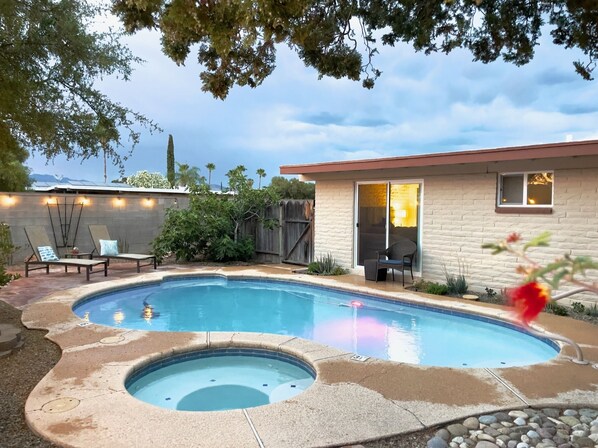 Heated pool and spa in backyard