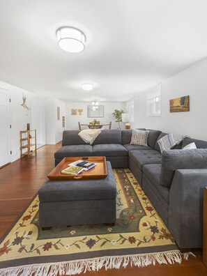 View of living room with dining room in the background