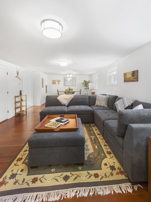 View of living room with dining room in the background