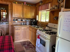 Kitchen is fully stocked with basic cooking utensils, mixer, blender, toaster