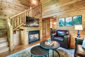 Cozy up to the warmth of the fireplace upon entry to Your Getaway Oasis.