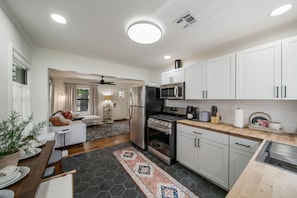 Open kitchen area with plenty of counter space for meal prep.