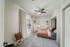 Plush carpet, ample windows (with blackout shades), ceiling fan, dresser, full length mirror, iron and ironing board, luggage rack, smart TV, private full bathroom with huge walk-in shower and private entrance are all included in the primary suite.
