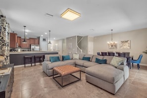 Living room with large sectional with TV