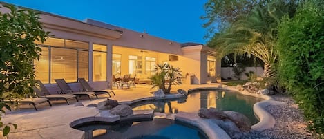 Spectacular backyard with heated pool and jacuzzi.