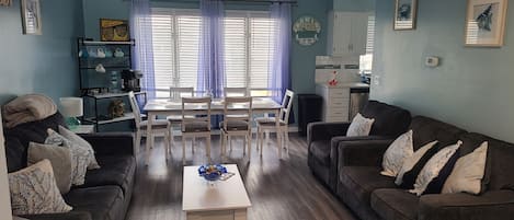 Living room with views of dining table. Our celling are vaulted. 