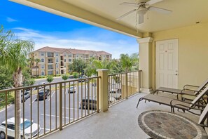 Mesmerizing private balcony of the condo in Orlando  - Cozy table and seats to enjoy the surrounding views - Be sure to get outside and enjoy the fantastic and stunning sunset views from your private balcony