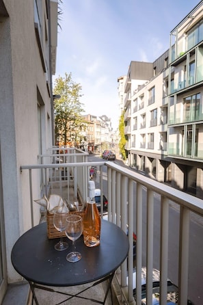 The apartment has a balcony that creates the perfect deck for you to sip on a glass of wine.