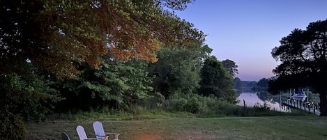 Relax by the water in comfortable Adirondack chairs