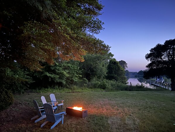 Relax by the water in comfortable Adirondack chairs