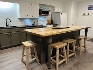 Huge open kitchen with 8ft live edge maple island countertop! 