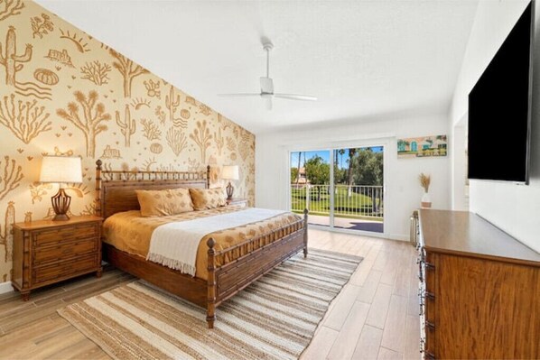 Master bedroom w/ 70” smart tv, walk-in closet, private balcony entrance. 