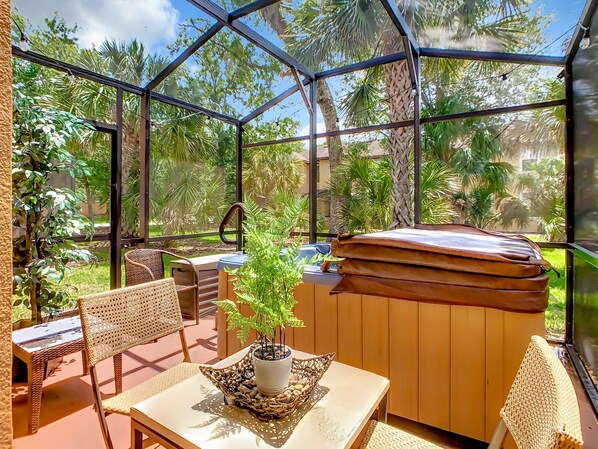 Enjoy your morning coffee in a cozy screened patio surrounded by nature views.