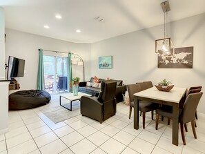 Bright and spacious living room with stylish decor and plenty of seating for relaxation.