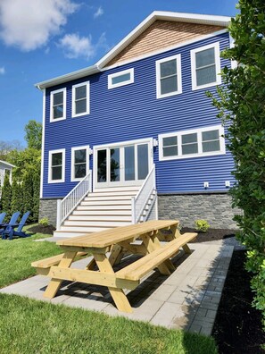 Outdoor dining area. Grill is to the right.