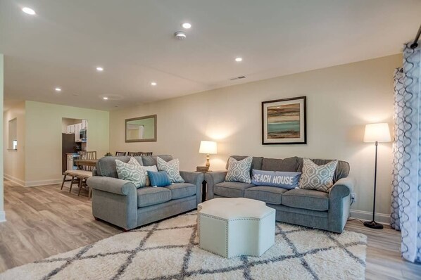 Enjoy relaxing and making memories in this spacious family room with new furniture.