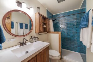 Beautiful, new bathroom with pebble tile on the floor. Does it look like Sand Harbor? All high end finishes too.