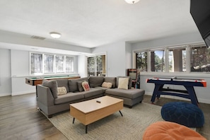 Downstairs Living Space with Air Hockey, Arcade, and Pool Table