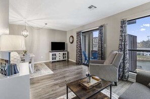 Living area with Roku TV and views of outside
