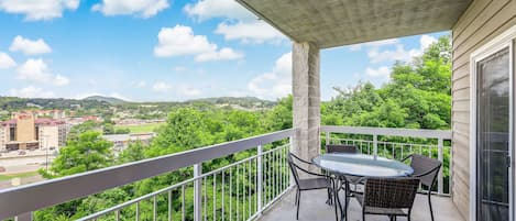 Relaxation on the Balcony - After a long day of fun, relax on the comfortable couch or gather around the table with friends and family to plan your next day's adventures.