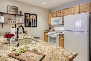 Kitchen has ample storage, along with a huge walk-in pantry. Oversized Island with granite counter tops.