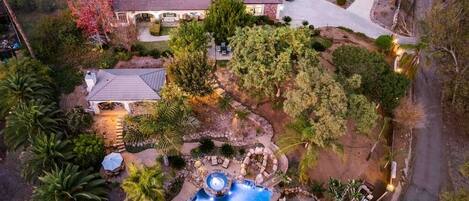 This gated 2 Acre Estate it  feels like paradise. It is a hidden gem and oasis in the foothills of Vista. Relax in the gorgeous resort style pool with waterfall, slide, Jacuzzi, enjoy 
The outdoor cabana with fireplace, full bar, barbecue & smoker