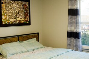 * Room with comfortable queen size bed
* Largest closet of the house
* Smart HDTV
* Window AC
* Side table with touch sensitive lamps
* Wireless charger for phones that support that feature