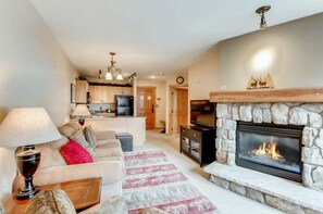 Cozy living room area with roaring fire