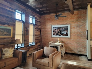 Exposed brick wall in great room