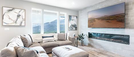 Relax on the oversized stuffed sectional as you take in one of the most amazing views in the Wasatch Back and 70" Smart TV above the "Wall of Fire"