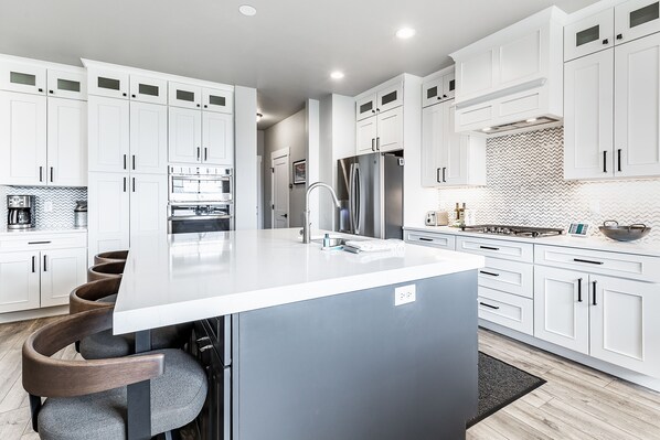A huge kitchen island dominates this brand new chefs kitchen.  We have stocked the kitchen with just about everything you could possibly need.