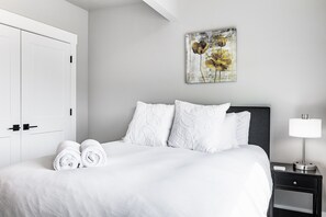 Downstairs Queen Bed, plush bedding and private as this is the only bedroom downstairs.  Beautiful views of the valley