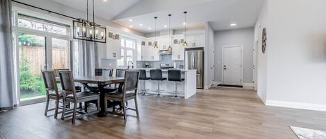 Dining Room with large kitchen island and bar stools
